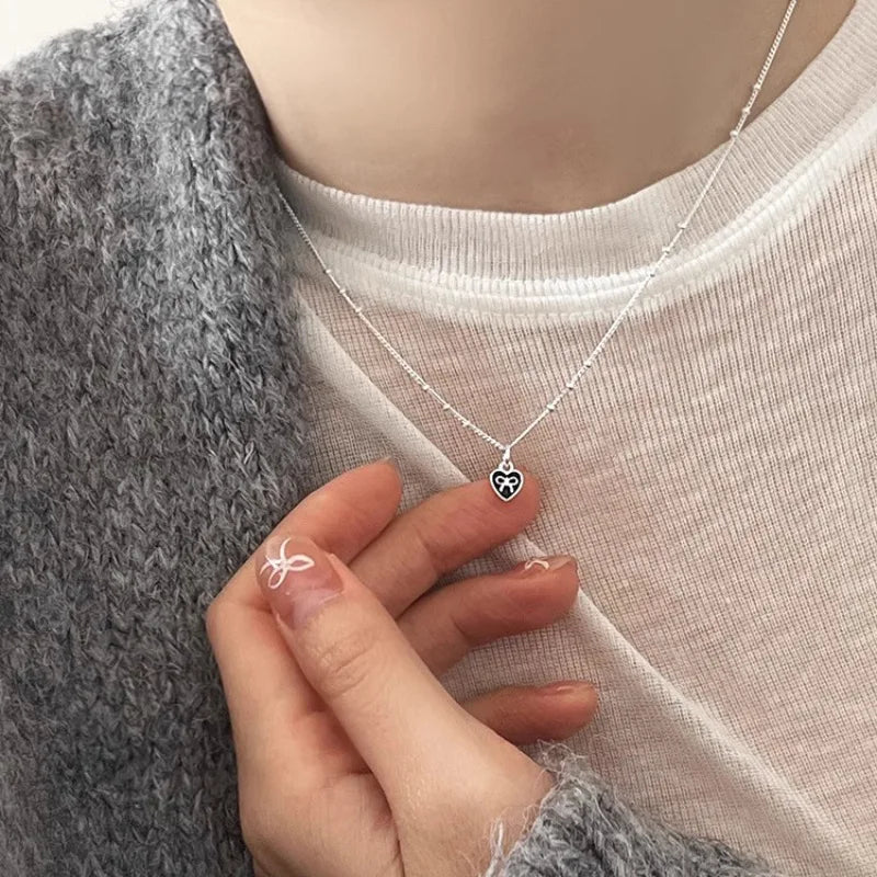 Silver Heart Necklace with Bow