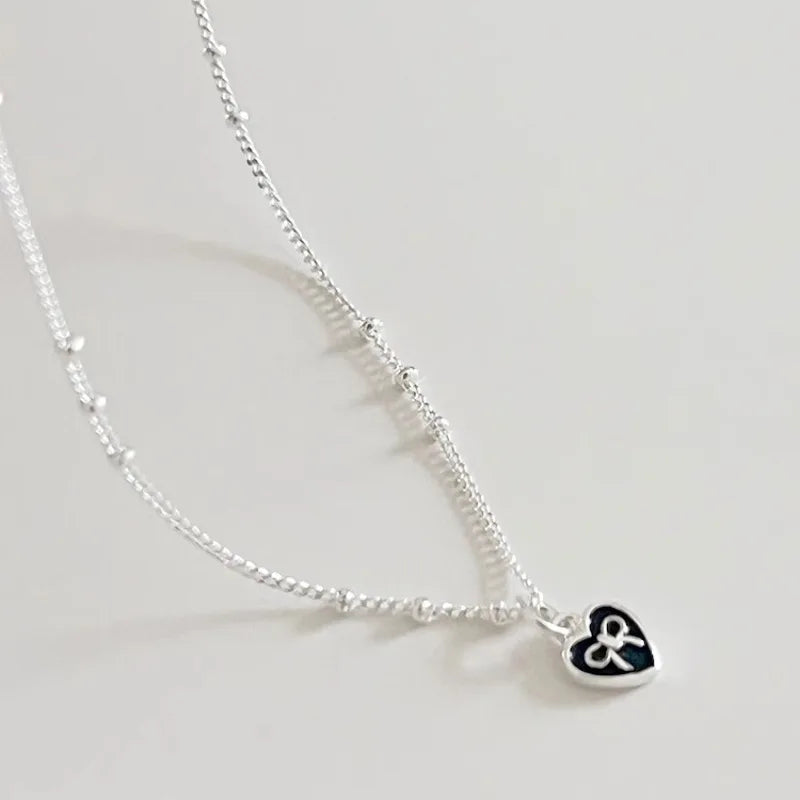 Silver Heart Necklace with Bow